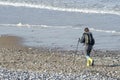 woman walking with sticks on the Opal Coast near the English Channel