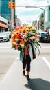 Woman walking in the street carrying a large bunch of flowers obscuring her face
