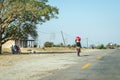 Woman walking in the street holding a bag in her head. South Africa, KwaZulu Natal