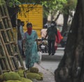 Woman walking the streets of India wearing a coronavirus protection mask