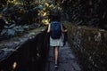 woman walking among surreal architecture, fantastic landscape, beautiful old castle, beautiful structures, jungle in the surreal