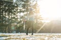 Woman walking thru slushy snow Royalty Free Stock Photo