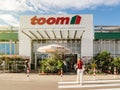 Woman walking to the Entrance of TOOM the German DIY-store chain