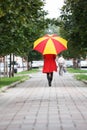 Woman walking with an umbrella