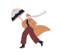 Woman walking under umbrella in autumn. Happy girl going in fall coat and scarf in windy weather, rainy day. Modern