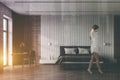 Woman walking in white bedroom with home office Royalty Free Stock Photo