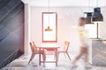 Woman walking in white and black kitchen Royalty Free Stock Photo