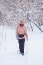 Woman walking in winter forest Royalty Free Stock Photo