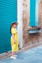 Woman walking in yellow dress at Paphos old city Royalty Free Stock Photo