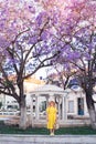 Woman walking in yellow dress at Paphos old city Royalty Free Stock Photo