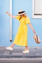 Woman walking in yellow dress at Paphos old city Royalty Free Stock Photo