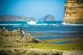 Woman Walks Alone on a Deserted Beach Royalty Free Stock Photo