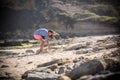 Woman Walks Alone on a Deserted Beach Royalty Free Stock Photo