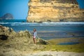 Woman Walks Alone on a Deserted Beach Royalty Free Stock Photo