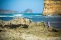 Woman Walks Alone on a Deserted Beach Royalty Free Stock Photo