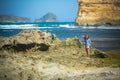 Woman Walks Alone on a Deserted Beach Royalty Free Stock Photo