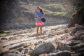 Woman Walks Alone on a Deserted Beach Royalty Free Stock Photo