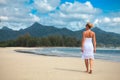 Woman walks on a beach Royalty Free Stock Photo