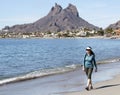 A Woman Walks the Beach, Tetakawi Mountain Behind, San Carlos, M Royalty Free Stock Photo