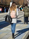 Woman walks on the city street in winter