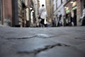 Woman walks on the cobblestone street in Rome Street in Italy Royalty Free Stock Photo