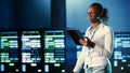 Woman walks through data center systems Royalty Free Stock Photo