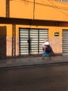A woman walks down the street in sunny Merida, Mexico - MERIDA - THE YUCATAN