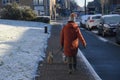 Woman walks pets in cold weather in Copenhagen Denmark Royalty Free Stock Photo