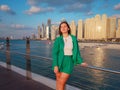 woman walks streets of Dubai, Dubai Marina