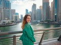 woman walks streets of Dubai, Dubai Marina