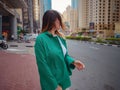 woman walks streets of Dubai, Dubai Marina