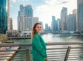 woman walks streets of Dubai, Dubai Marina