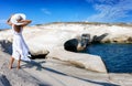 Woman walks through the volcanic landscape of Sarakiniko on the Greek island of Milos Royalty Free Stock Photo