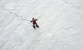 A woman walks in winter with snowshoes