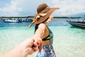 Woman wanting man to follow in honeymoon to beach Royalty Free Stock Photo