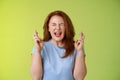 Woman wants win badly. Enthusiastic lucky redhead middle-aged 50s female pleading implore god make dream come true cross