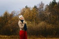Woman in warm clothes in the fall Royalty Free Stock Photo