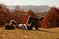 Woman in warm clothes relaxing on slope