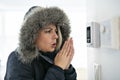 Woman With Warm Clothing Feeling The Cold Inside House Royalty Free Stock Photo