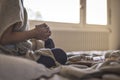 Woman in warm cosy clothes drinking hot drink