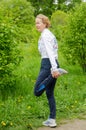 Woman warm up before the start of the running competition among senior athletes