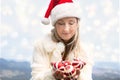 Woman holding Christmas baubles - Christmas in Blue Mountains