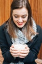 Woman warming hands with hot drink Royalty Free Stock Photo