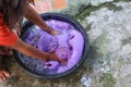 Woman wash hands dirty clothes in the basin black for cleansing Royalty Free Stock Photo