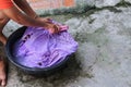 Woman wash hands dirty clothes in the basin black for cleansing Royalty Free Stock Photo