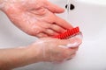 Woman wash soapy hands in bathroom Royalty Free Stock Photo