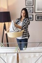 Woman with a washbowl full of washed clothes Royalty Free Stock Photo