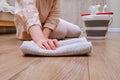 A woman washes the laminate floor with a rag while cleaning the home living room Royalty Free Stock Photo