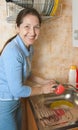 Woman washes ware Royalty Free Stock Photo