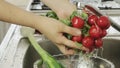 Woman washin vegetables